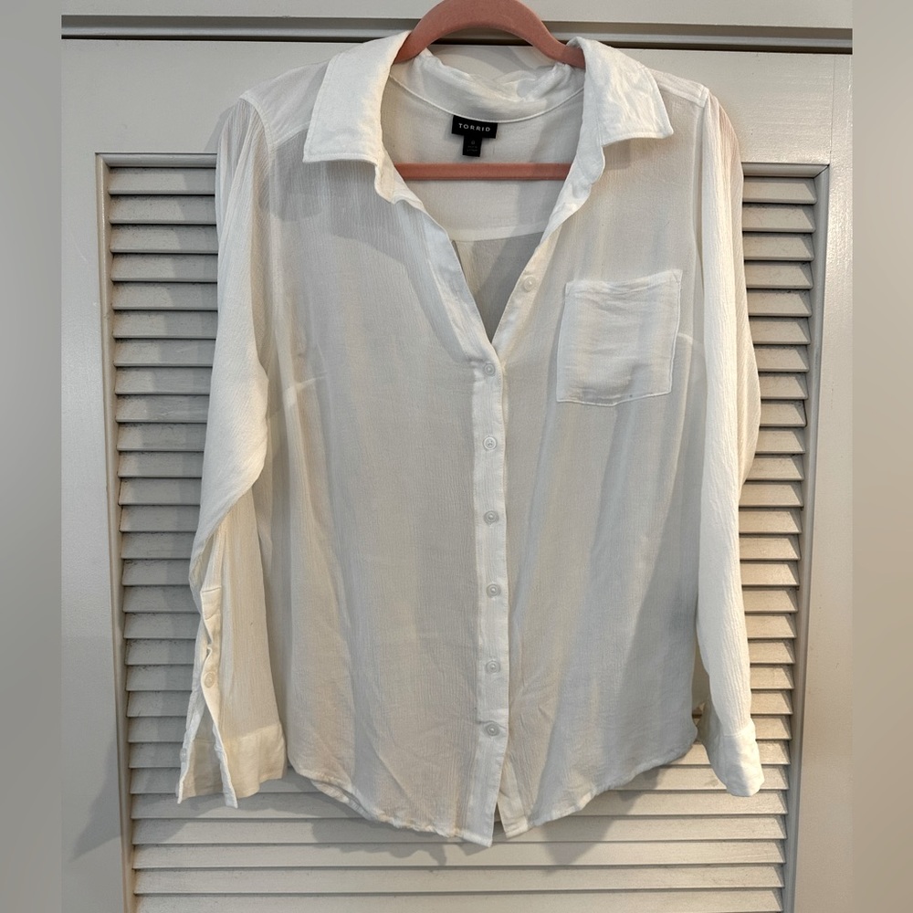 Sheer/light long sleeve white beach shirt.